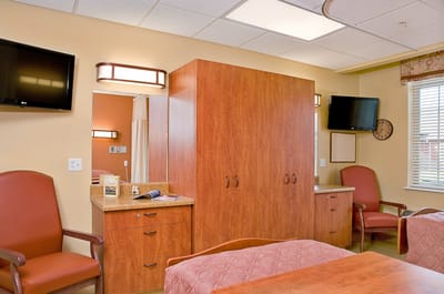 Cozy interior of a resident room with furniture