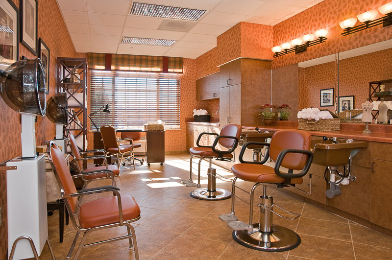 A well-lit salon area with styling chairs and mirrors