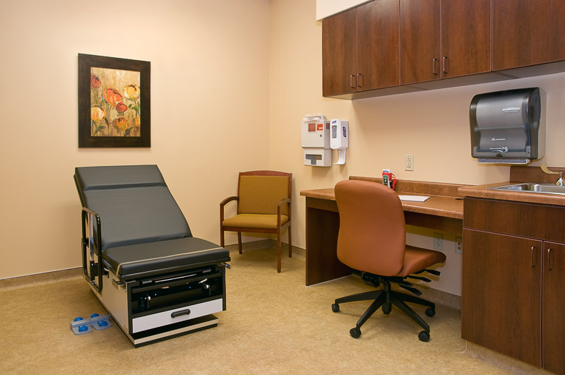 Clean examination room with medical equipment and decor