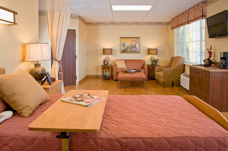 Private resident room with warm decor and furniture