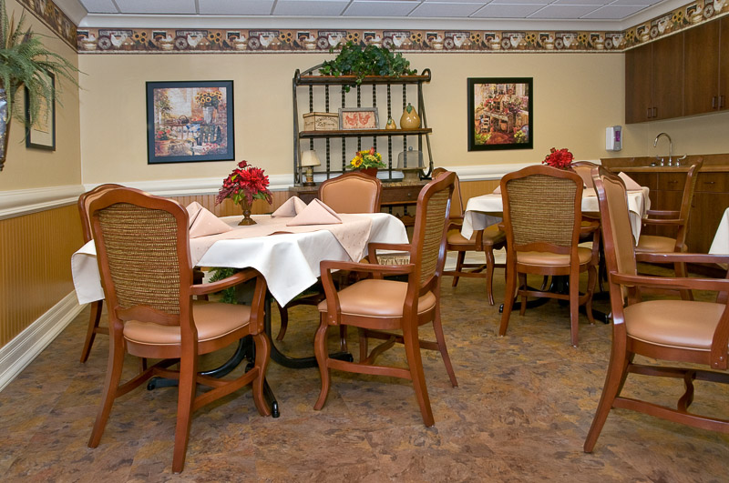 Dining area with tables and chairs set for a meal