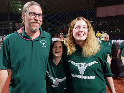 Three Marbridge Longhorns team members smiling together
