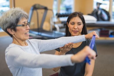 Therapy session with a resident and staff member