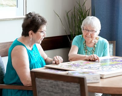 Two female residents enjoying an activity together