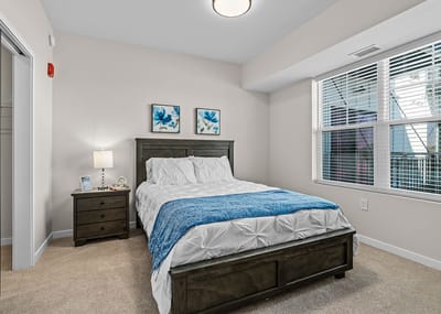 Private resident room with a bed and nightstand