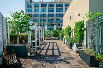 Outdoor area with benches and greenery