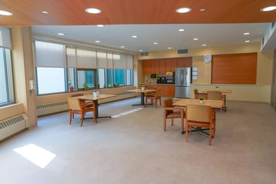 Bright dining area with tables and chairs