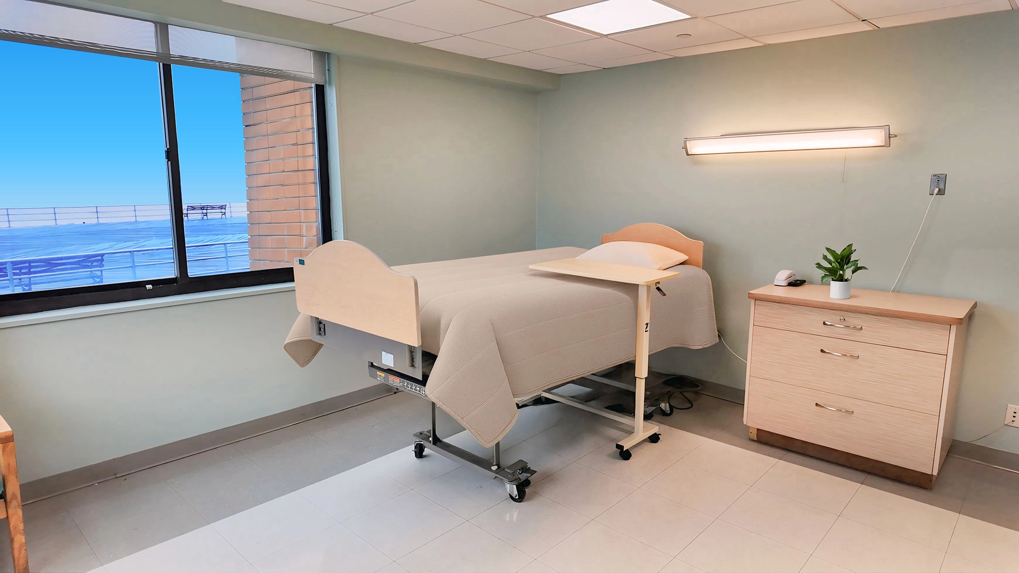 Patient room with a bed and minimal decor