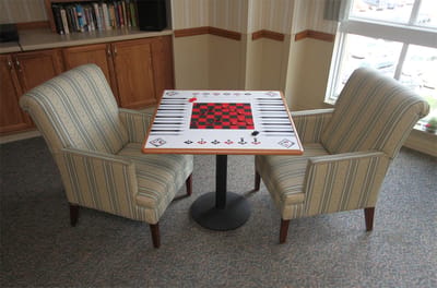 Common area with checkerboard table and chairs