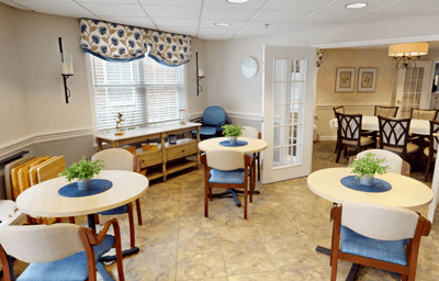 Bright common area with tables and chairs