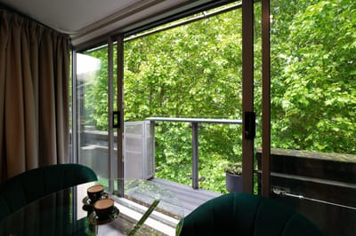 View of a balcony surrounded by trees