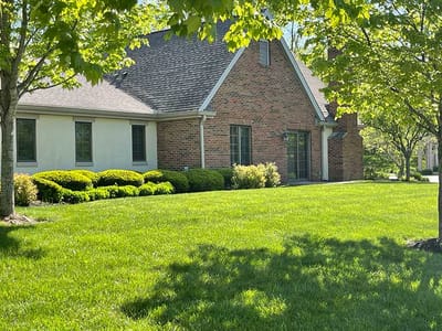 Exterior view of a brick building with landscaping