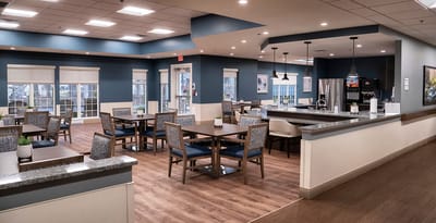 Bright dining area with tables and chairs