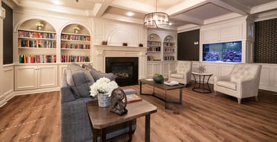 Cozy common area with a fireplace and bookshelves