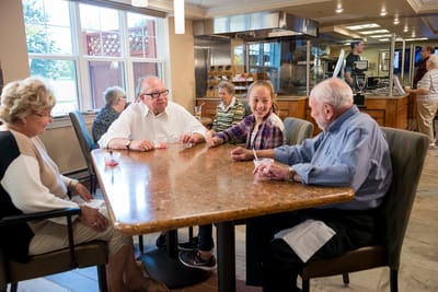 Wesley Village, Nursing Home in Pittston, PA — Residents engaging in a lively card game