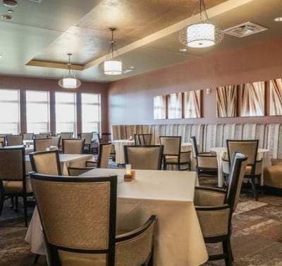 Elegant dining room with tables and seating