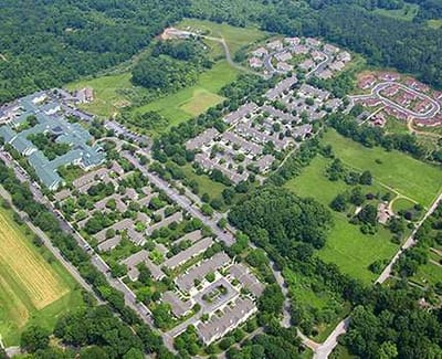 Aerial view of the White Horse Village campus with green spaces