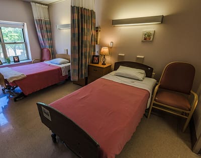 Interior view of a shared resident room with two beds
