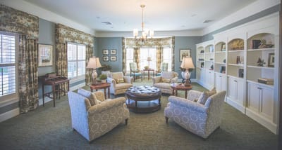 A well-furnished common area with comfortable seating