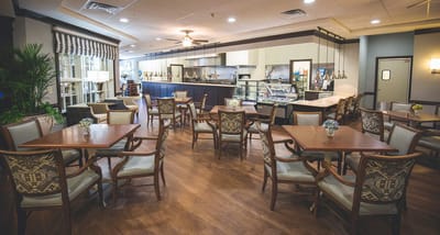 Bright dining area with tables and chairs