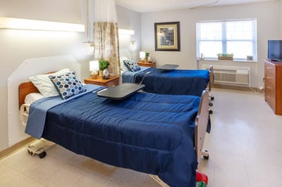 Bright interior of a resident's room with two beds