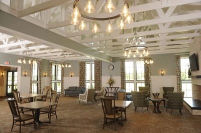 Bright common area with seating and decorative lighting