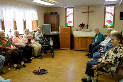 Residents engaged in a group activity in a common area