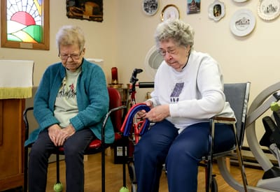 Two residents engaged in an activity in a cozy common area