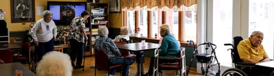 Residents socializing in the common area of the facility