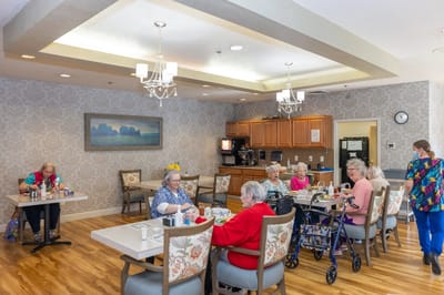 Residents enjoying meals in a dining room