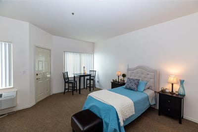 Cozy private bedroom with a bed and table