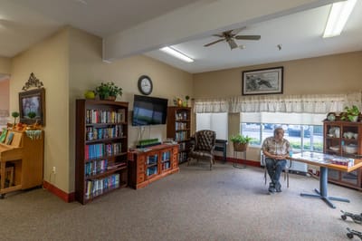 Common area with seating and bookshelf
