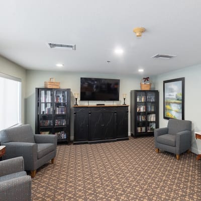 Common area with seating and bookshelf
