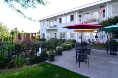 Outdoor patio with tables and garden