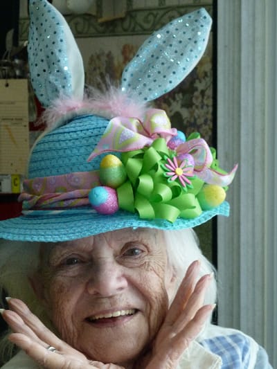 Resident wearing a festive Easter-themed hat