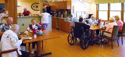 Residents enjoying meals in a common dining area