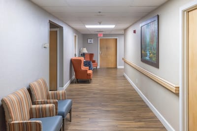Bright hallway with seating and artwork on the wall