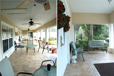 A covered outdoor seating area with plants