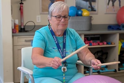 Resident participating in a dance therapy session