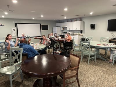Residents engaging in a game activity in a common area