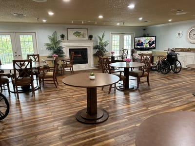 Interior dining area with tables and a television