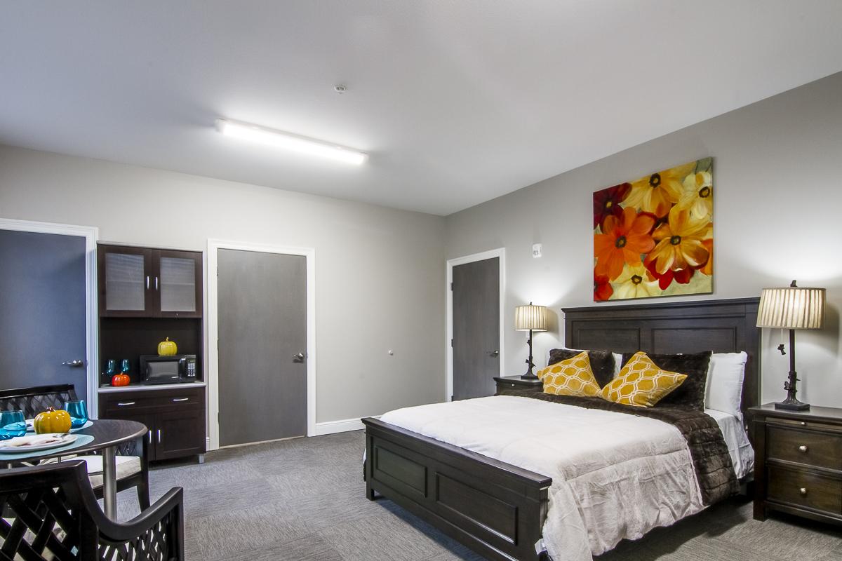 Resident room with a bed and sitting area