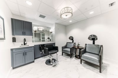 Interior beauty salon area with salon chairs and mirrors