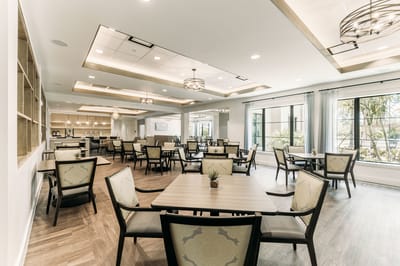 Bright dining room with tables and chairs