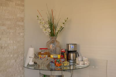 Coffee station with snacks and flowers in the lobby