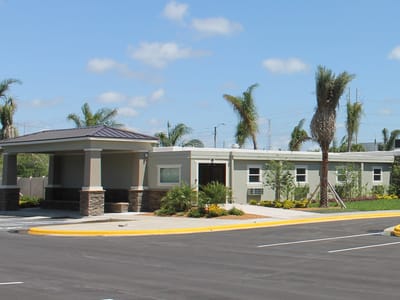 Exterior view of Walton Place facility entrance and landscaping