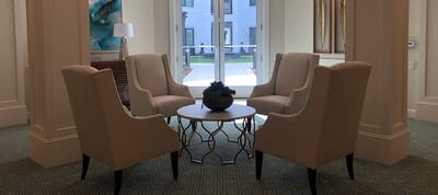 Lounge area with chairs and a coffee table