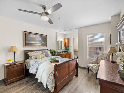 Cozy resident room with a bed and seating area