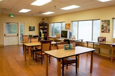Bright interior of a common area with tables and chairs