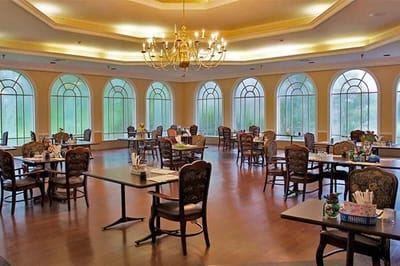 Bright dining room with large windows and tables